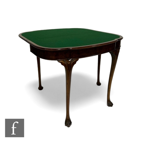 998 - A Queen Anne style figured walnut fold over card table, the moulded edge shaped top over a plain fri... 