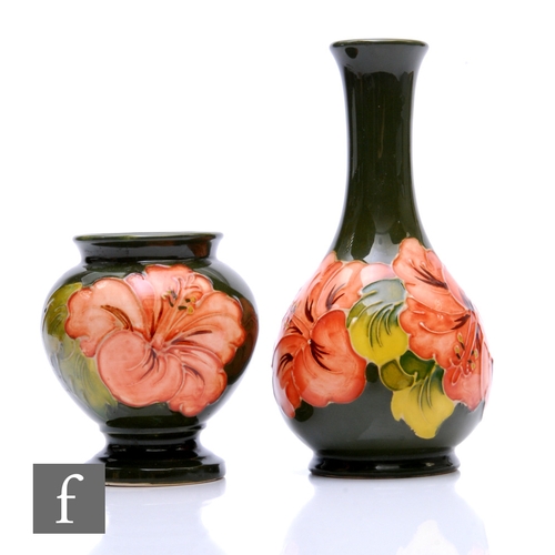 127 - A post war Walter Moorcroft vase of footed globe and shaft form, tube line decorated in the Coral Hi... 