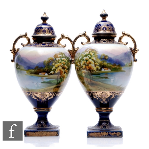 187 - A large pair of early 20th Century Noritake pedestal vases, each with a square foot and socle base r... 