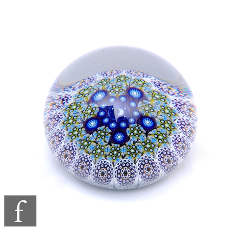 599 - A later 20th Century Mike Hunter for Twists Glass paperweight, of domed form, internally decorated w... 