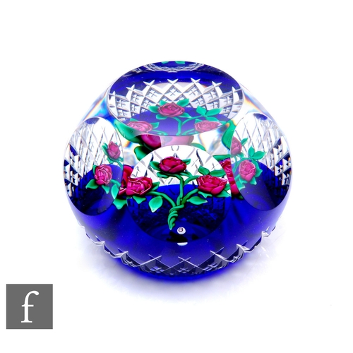 611 - A later 20th Century Ray Banford glass paperweight, of domed form with facet cut sides and top, inte... 