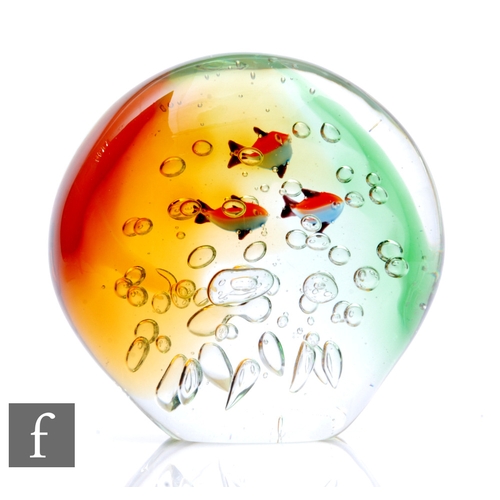 635 - A Murano oversized weight, of ovoid form, internally decorated with three tropical fish swimming thr... 