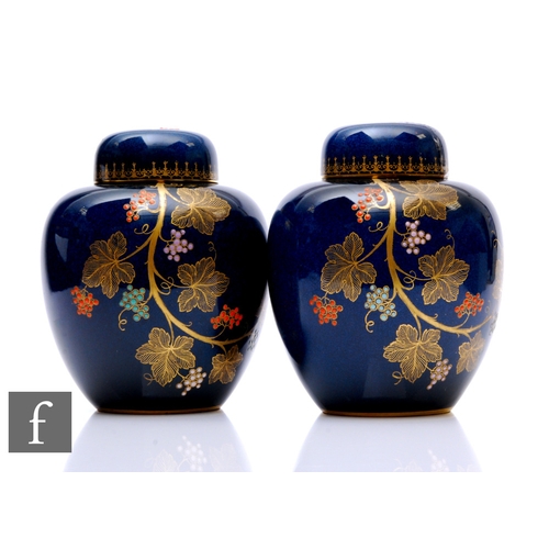 98 - A pair of late 1930s Carlton Ware ginger jars and covers decorated in the Grape Vine pattern with a ... 