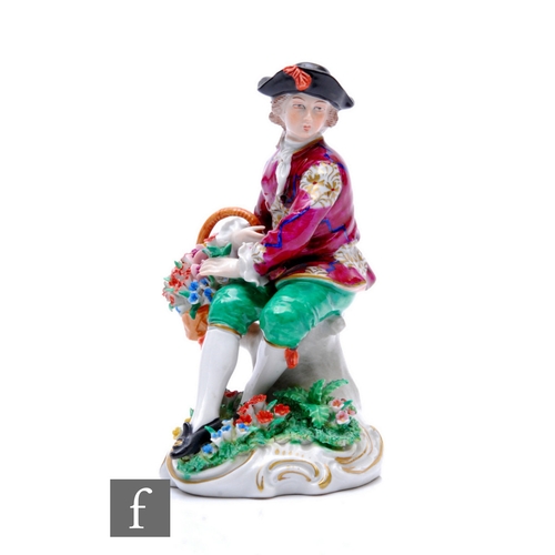 151 - A 20th Century Sitzendorf figure of a flower gatherer in period costume resting to a floral encruste... 