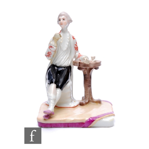 172 - A 18th Century continental hard paste Ludwigsburg porcelain figure of a seated gentleman in period d... 