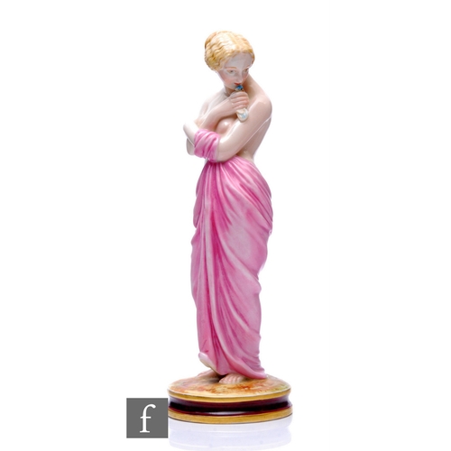 200 - A late 19th Century Royal Worcester figure of 'Joy' modelled as a scantily clad lady with draped rob... 