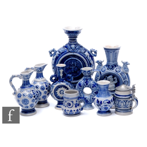 249 - A collection of early 20th Century German Westerwald salt glazed stonewares to include moon flasks, ... 