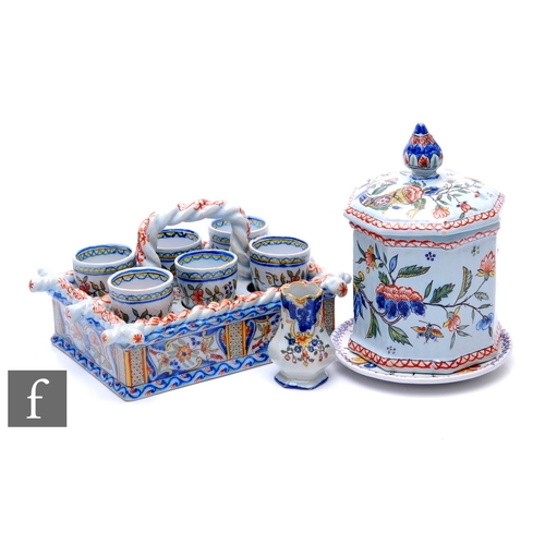 263 - A late 19th Century French Faience ware egg cup set by Desvres Fourmaintraux, the rectangular carry ... 