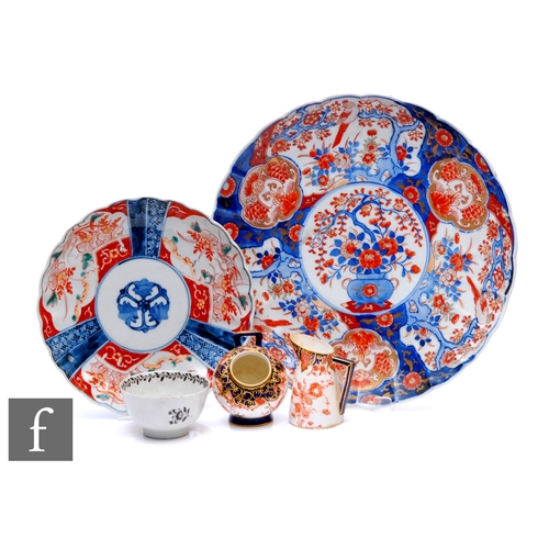 299 - A large late 19th to early 20th Century Japanese Imari charger decorated with panels of exotic birds... 