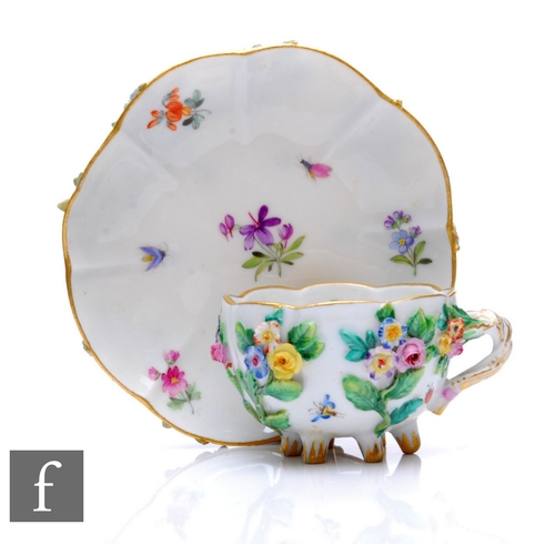 169 - A 19th Century Meissen cabinet cup and saucer, the fluted cup with rustic cross handle and raised to... 