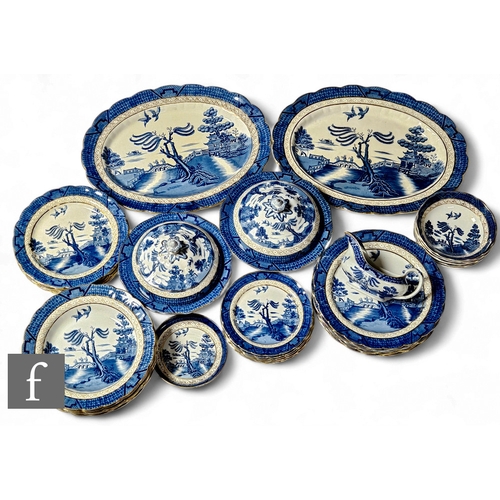 217 - An early 20th Century Booths Real Old Willow six place dinner service comprising two meat plates, tw... 