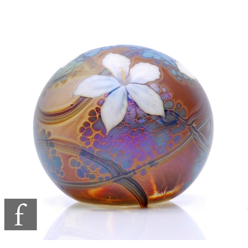 640 - A contemporary Richard P. Golding glass paperweight, of domed form decorated to the surface with sty... 