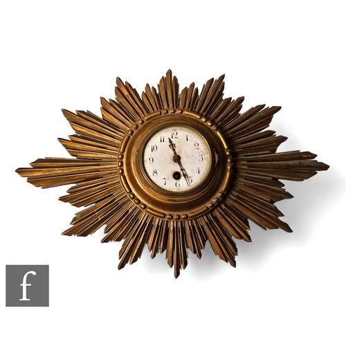 174 - A 1920s French gilt sunburst wall clock, white circular dial, width 46cm.