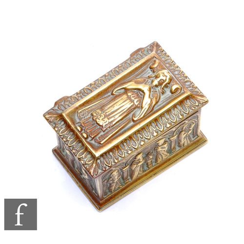 178 - An ecclesiastical style brass trinket box decorated with medieval style figures and modelled as a to... 