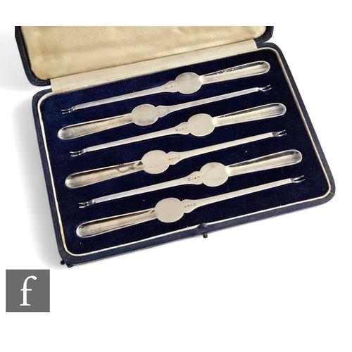 182 - A cased set of six early 20th Century silver plated lobster picks of plain form, cased, Harrods, Lon... 