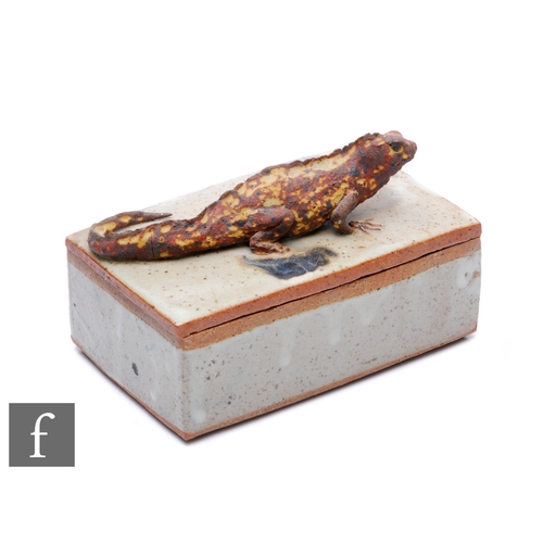 206 - A 20th Century glazed stoneware rectangular box, the cover mounted with an iguana, width 16cm.