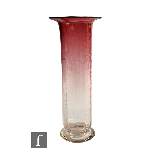 403 - A Victorian glass vase, of footed cylinder form with flared flat rim, the optic ribbed body decorate... 