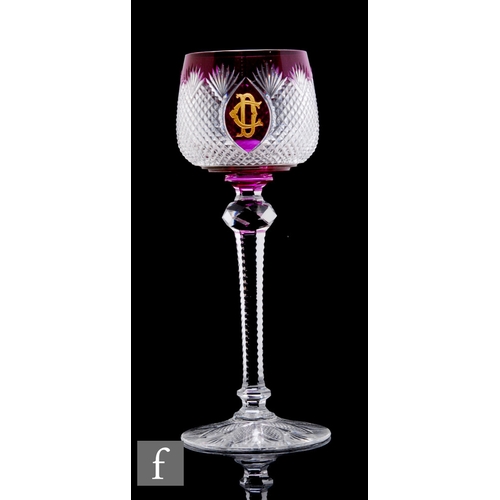 443 - An early 20th Century Stevens & Williams drinking glass, the ovoid bowl cased in amethyst over c... 