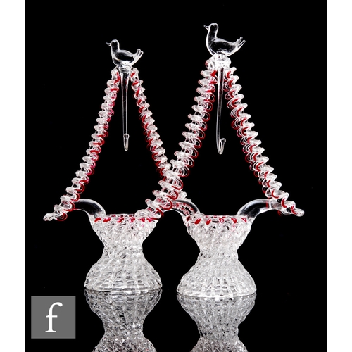 494 - A pair of late 19th Century clear crystal rigger work stylised wishing well, with a stylised bird pe... 