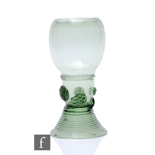 499 - An 18th Century continental Roemer glass, the ovoid bowl above an integral stem with applied rigger ... 