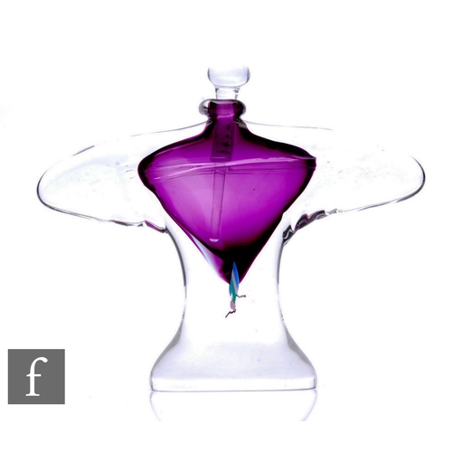 504 - A later 20th Century Chris Comins studio glass scent bottle, of compressed winged form cased in clea... 