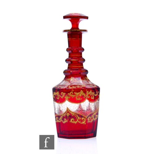 334 - A 19th Century Bohemian spirit decanter of hexagonal form, cased in ruby over clear crystal with gil... 