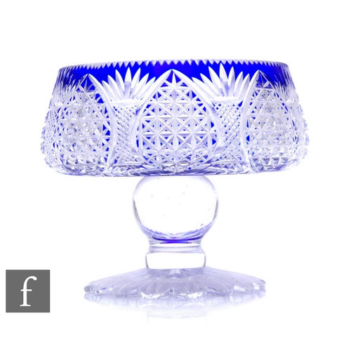 337 - A large early 20th Century Stourbridge crystal glass pedestal bowl cased in blue and flash cut with ... 