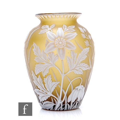 A late 19th Century Thomas Webb & Sons cameo glass vase of shouldered ovoid form with everted rim, cased in opal over citron and cut with wild flowers below a stiff leaf border, height 13.5cm.
