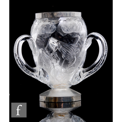 353 - An early 20th Century Stevens & Williams clear crystal three handled tyg with rock crystal style... 