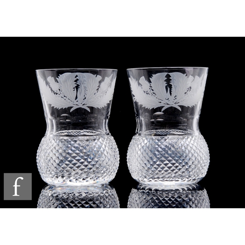 356 - A pair of 20th Century Edinburgh Crystal thistle form whisky glasses with engraved thistle decoratio... 