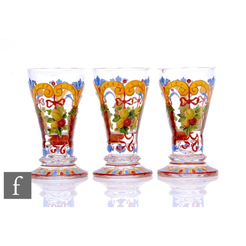 377 - A trio of late 19th Century Bohemian small shot glasses with hand enamelled decoration, height 9cm, ... 