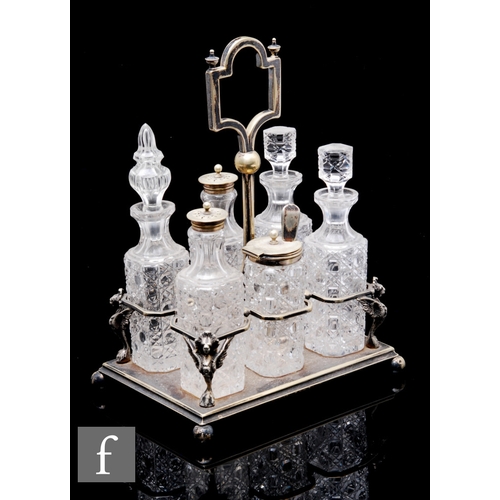 385 - A 19th Century condiment set with six clear crystal glass bottles with cut decoration to a silver pl... 