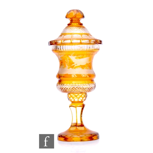 397 - A late 19th Century Bohemian covered pedestal cup, cased in amber over clear crystal and flash cut w... 