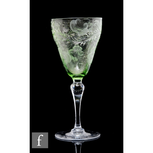 402 - An early 20th Century drinking glass, the ogee form bowl in pale green and polished intaglio cut wit... 