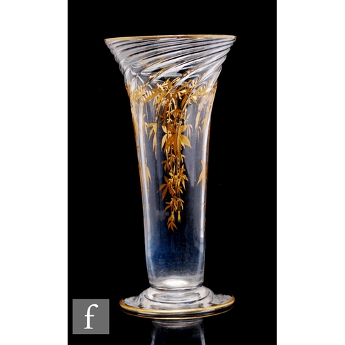 406 - A Stuart & Sons clear crystal glass vase, of footed flared form, the body decorated with wrythen... 