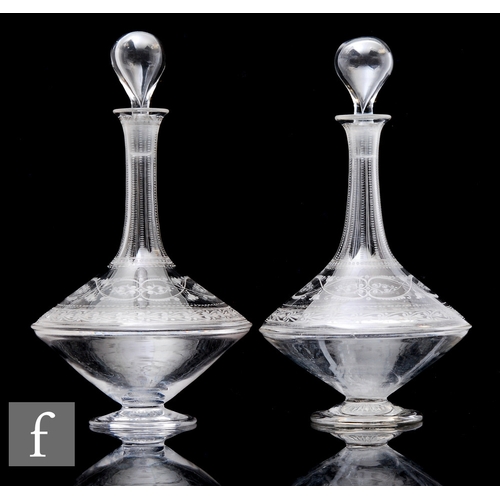 408 - A pair of continental clear crystal glass decanters, of footed angular form with tall collar neck, t... 