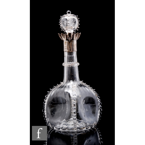 421 - A late 19th Century clear crystal decanter of globe and shaft form, the body with dimpled sides and ... 