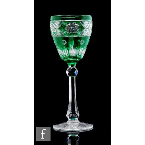 457 - An early 20th Century Stevens & Williams drinking glass, the ovoid bowl cased in emerald green o... 