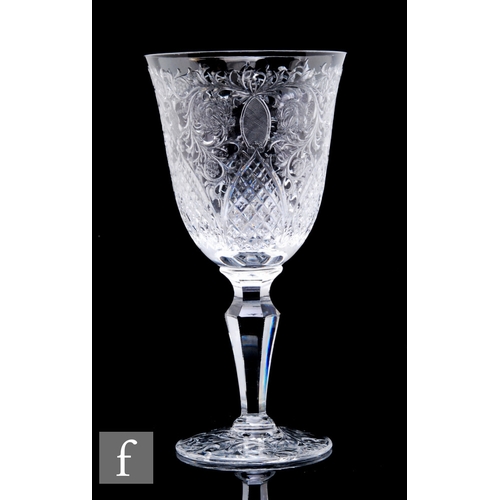 419 - A Thomas Webb & Sons polished intaglio wine goblet with foliate motif above gothic arches, above... 