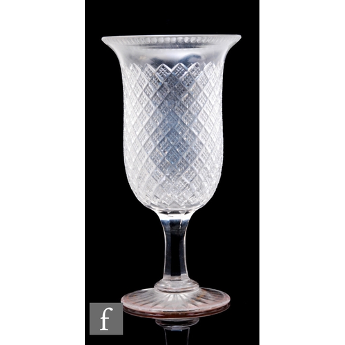 440 - A late 19th Century clear crystal vase of bell form with a strawberry diamond cut body above a facet... 