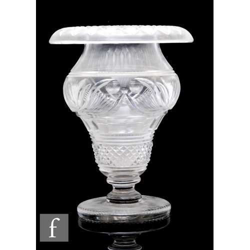 405 - A large 19th Century clear crystal Anglo-Irish pedestal bowl with a roll rim and pedestal stem, heav... 