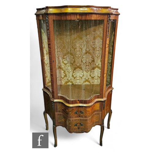 1004 - A late 20th Century Louis XIV style floral marquetry inlaid display cabinet of serpentine out line, ... 