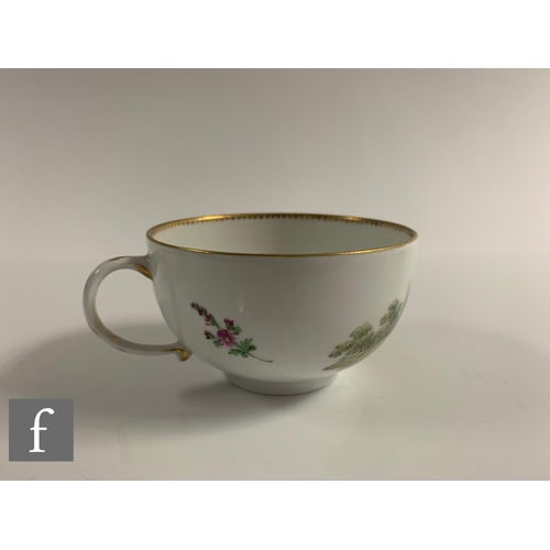 168 - A late 18th Century Meissen porcelain tea cup and saucer, the circular cup with loop handle, hand en... 