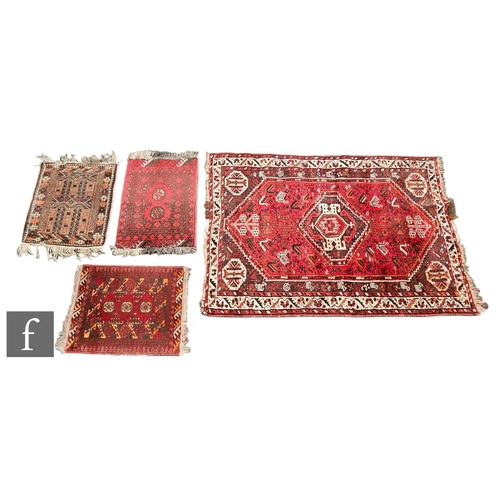 1067 - A Hamadan rug, the central lozenge on a deep red ground within running leaf border, 156cm x 113cm, t... 