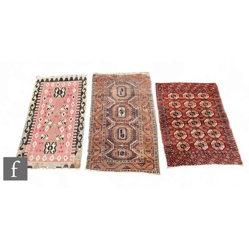 1069 - A Hamadan rug, three rows of guls on a dark red ground with stylised border, 120cm x 92cm, a worn Be... 