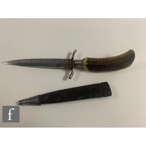 759 - An early 20th Century Bavarian hunting knife with leather scabbard and horn handle, a similar brass ... 