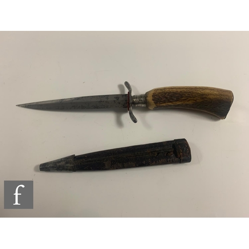 759 - An early 20th Century Bavarian hunting knife with leather scabbard and horn handle, a similar brass ... 