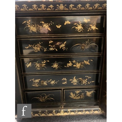 10 - A 19th Century Chinese lacquer table cabinet fitted with four long two short floral decorated drawer... 