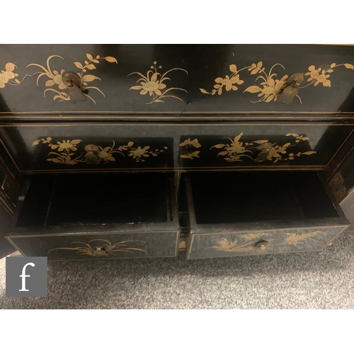 10 - A 19th Century Chinese lacquer table cabinet fitted with four long two short floral decorated drawer... 