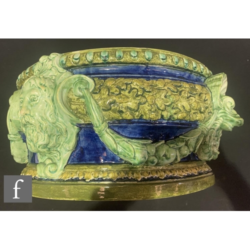 203 - A late 19th Century Della Robbia of Birkenhead pottery jardinière, the footed circular body, heavily... 